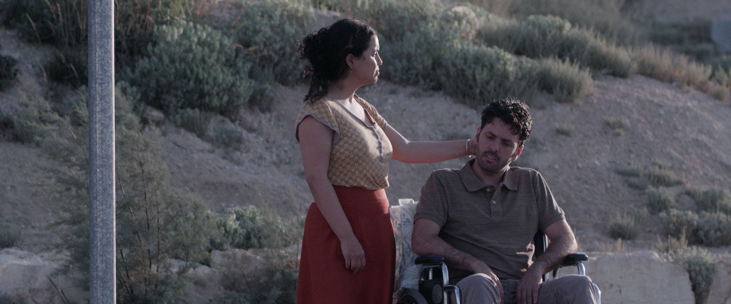 מתוך הסרט "מאמי" אישה ואיש על כסא גלגלים